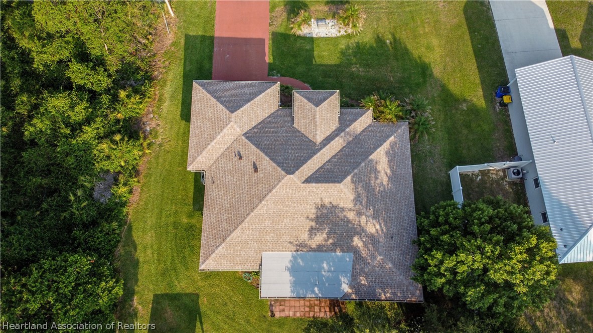 309 Lark Terrace Sebring, FL 33872 - Photo 28 of 32 an aerial view of a house with a yard