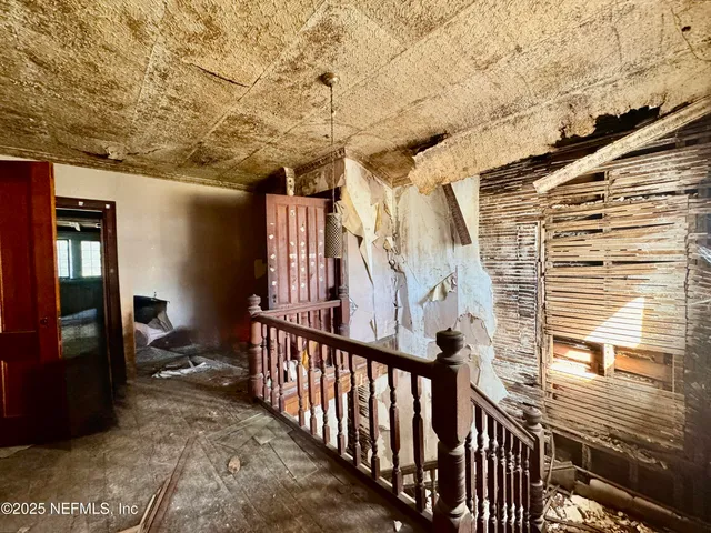a view of a hallway and living room