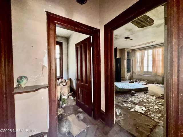 a view of a hallway with windows