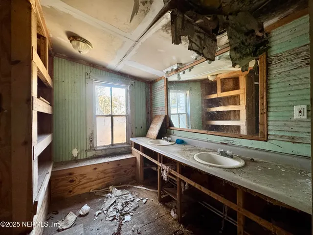 a bathroom with a toilet sink and shower