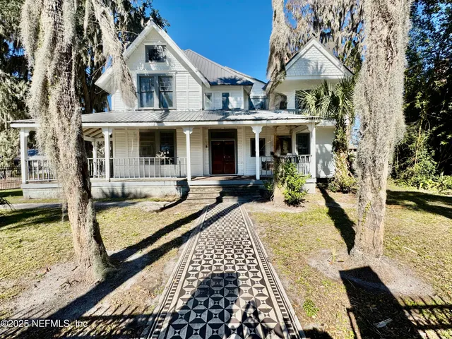 a view of a house with swimming pool