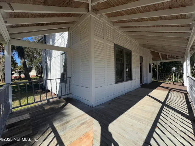 a view of a balcony with chairs