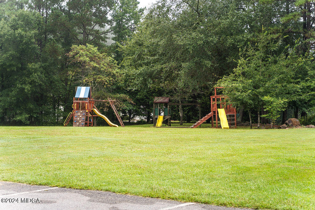 187 Bateman Lane Gray, GA 31032 - Photo 26 of 27 a view of a swimming pool with an outdoor space and seating area