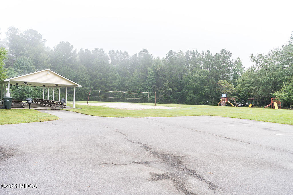 187 Bateman Lane Gray, GA 31032 - Photo 27 of 27 a view of a swimming pool and trees in the background