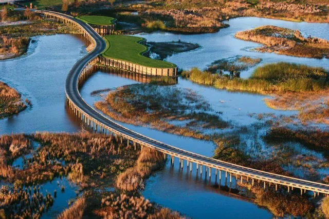a view of a backyard with swimming pool table and chairs