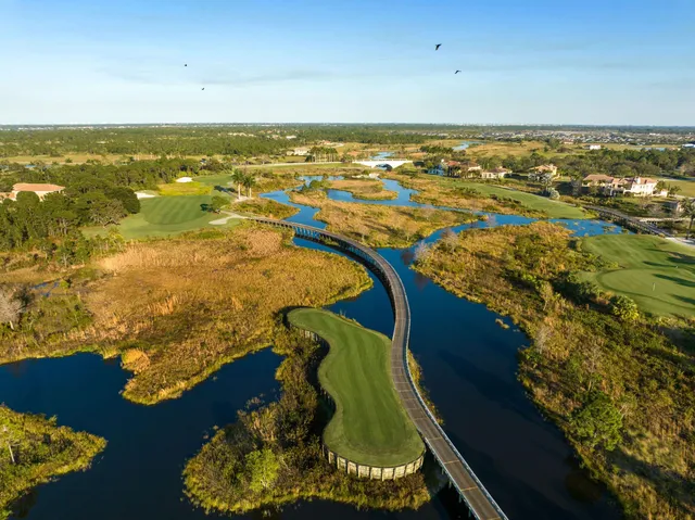 an aerial view of a house with a lake view
