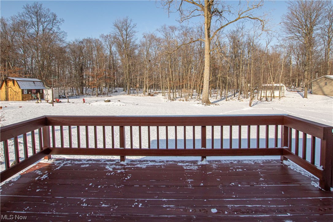 3711 Ruth Drive Brunswick, OH 44212 - Photo 29 of 35 Snow covered deck featuring a shed