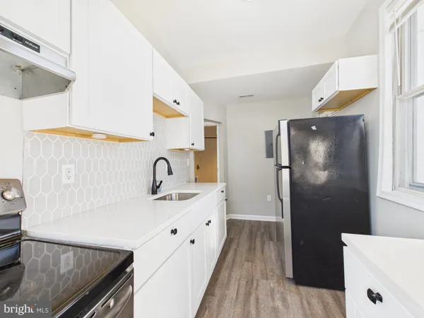 a view of cabinets with wooden floor