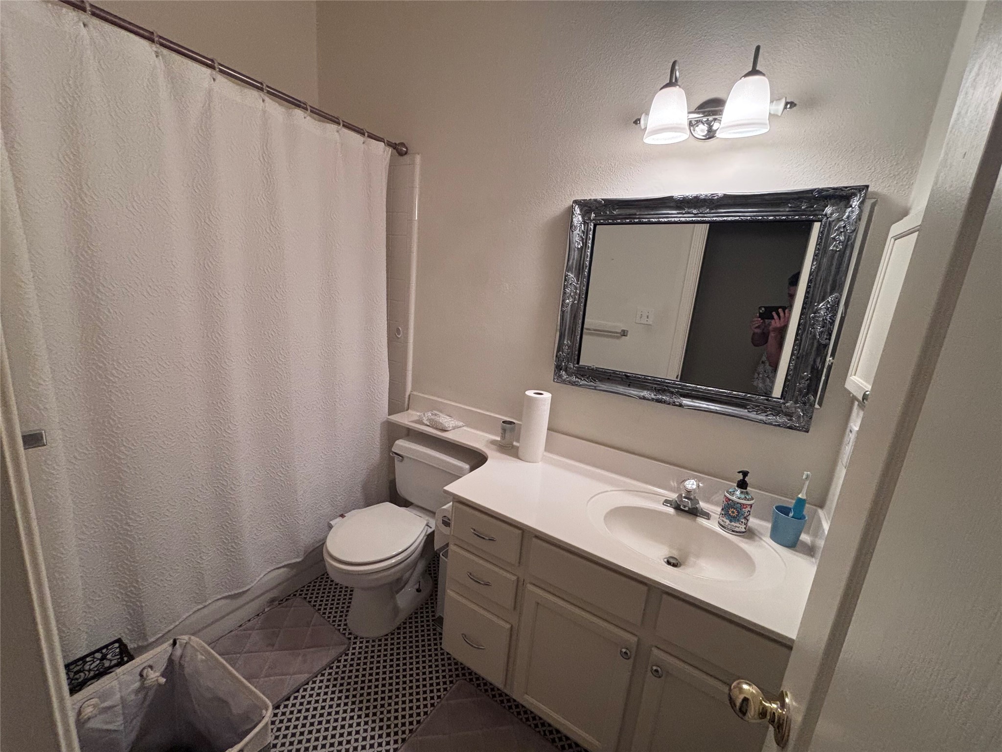 1316 Mesquite Road Cedar Park, TX 78613 - Photo 8 of 24 A well-appointed bath features a vanity with ample counter space and an ornate mirror.
