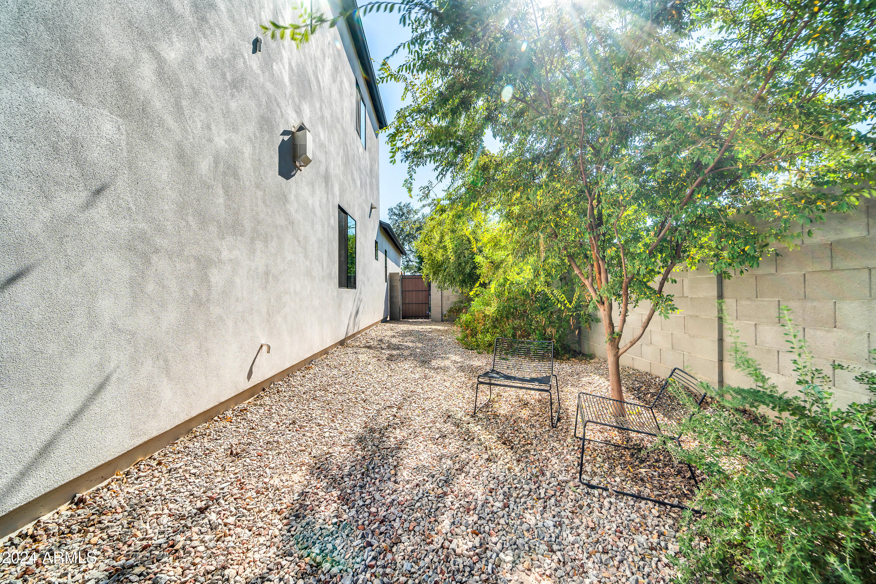 7240 North 13th Lane Phoenix, AZ 85021 - Photo 55 of 69 a view of a backyard with plants and large trees