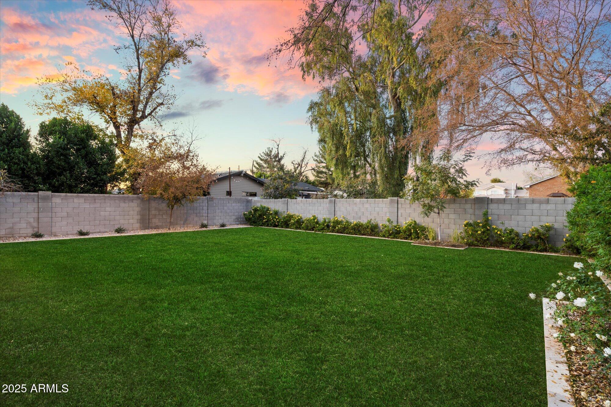 7240 North 13th Lane Phoenix, AZ 85021 - Photo 59 of 69 a view of yard with grass and trees