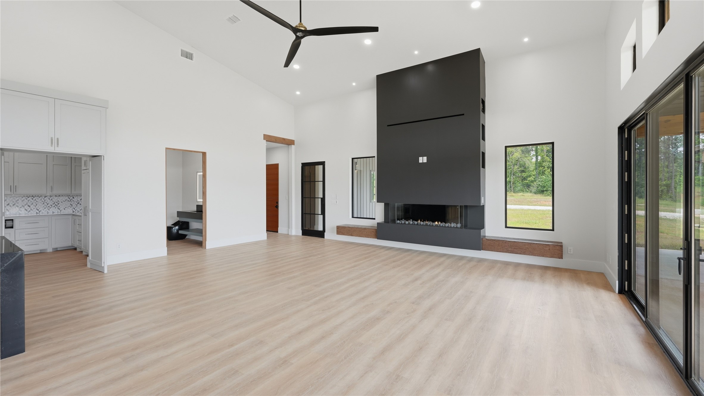 447 County Road 2211 Rusk, TX 75785 - Photo 30 of 50 a view of a livingroom with wooden floor and a ceiling fan