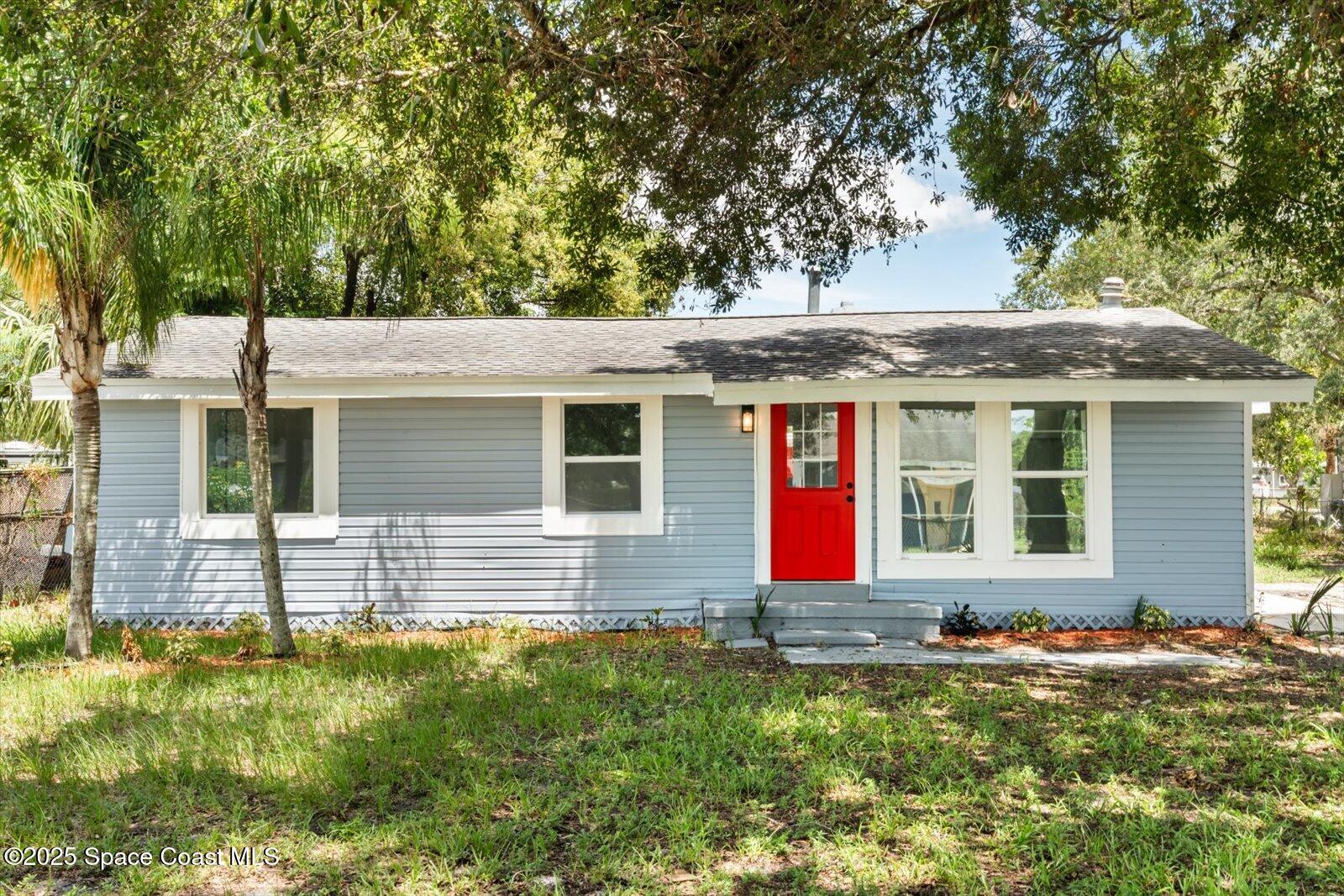 1436 Melrose Street Cocoa, FL 32922 - Photo 1 of 28 front view of house with a yard