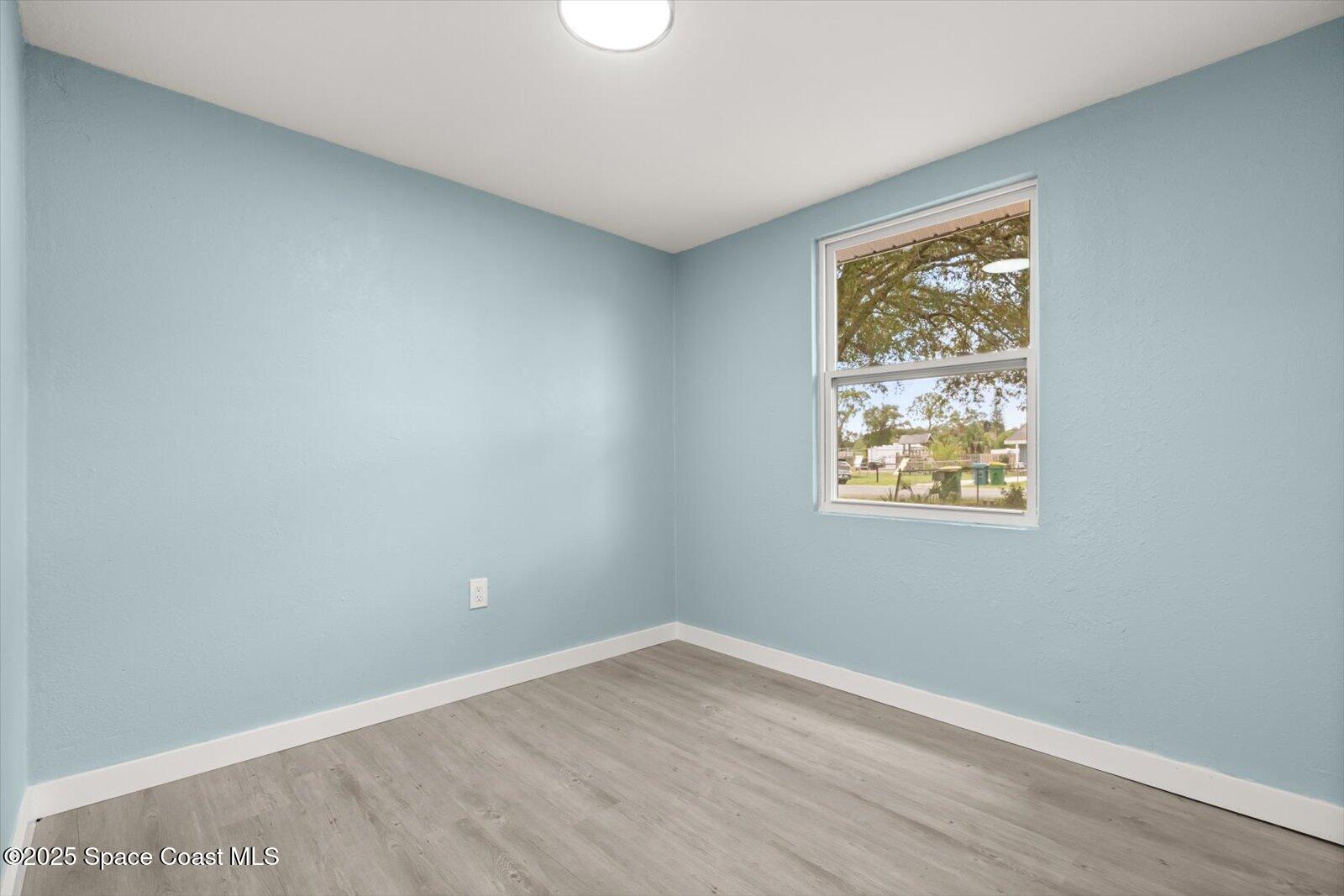 1436 Melrose Street Cocoa, FL 32922 - Photo 17 of 28 an empty room with a window