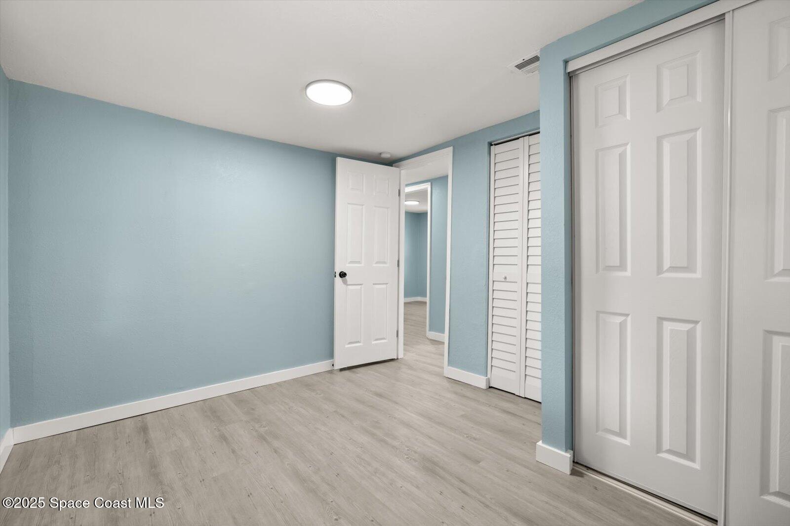 1436 Melrose Street Cocoa, FL 32922 - Photo 22 of 28 wooden floor in an empty room