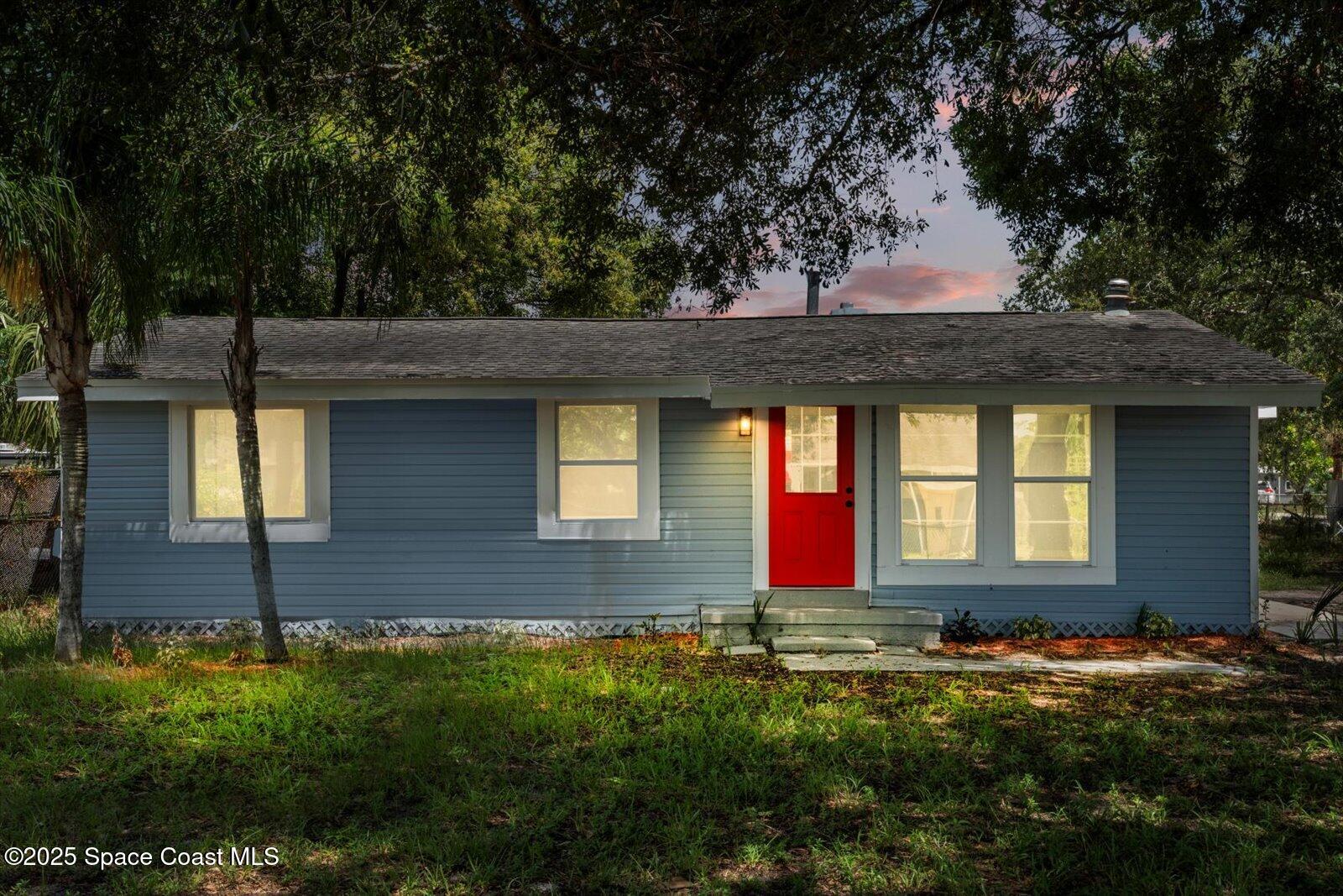 1436 Melrose Street Cocoa, FL 32922 - Photo 28 of 28 a front view of house with yard