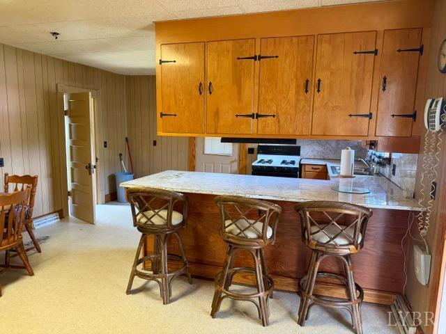 439 Midgett Farm Road Concord, VA 24538 - Photo 10 of 27 a kitchen with a table chairs and a refrigerator