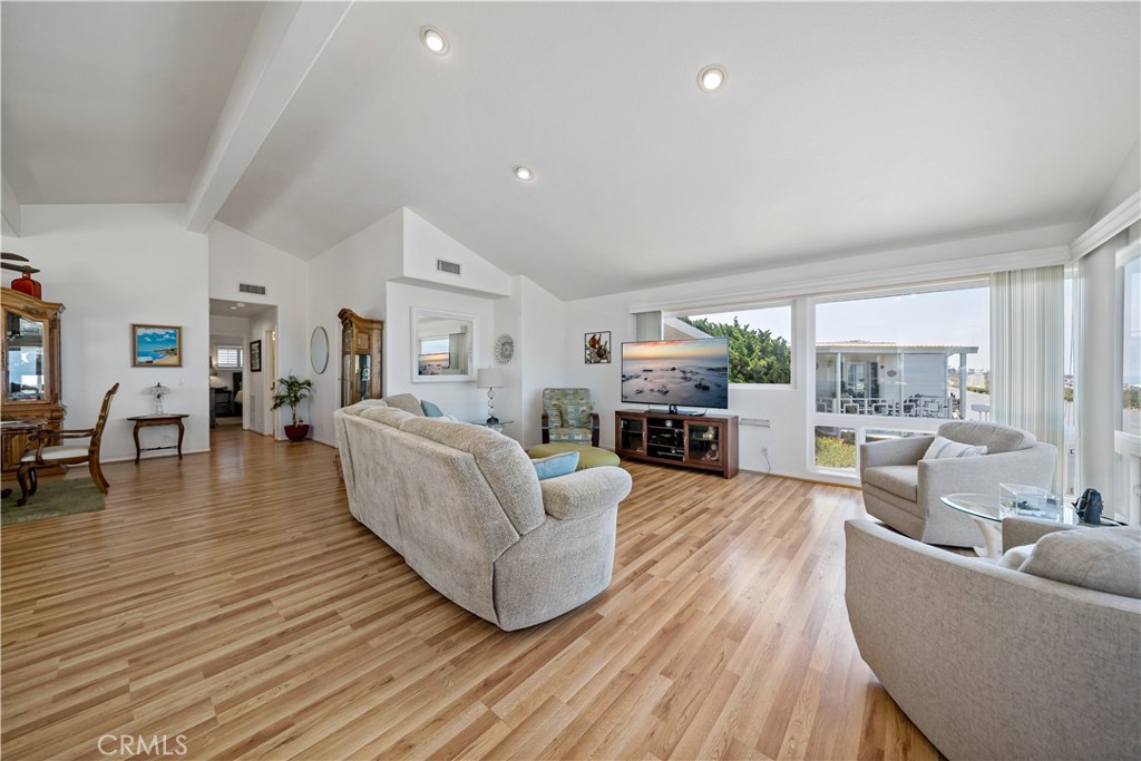 6536 Oceanview Drive, Unit T Carlsbad, CA 92011 - Photo 11 of 44 a living room with furniture and a wooden floor