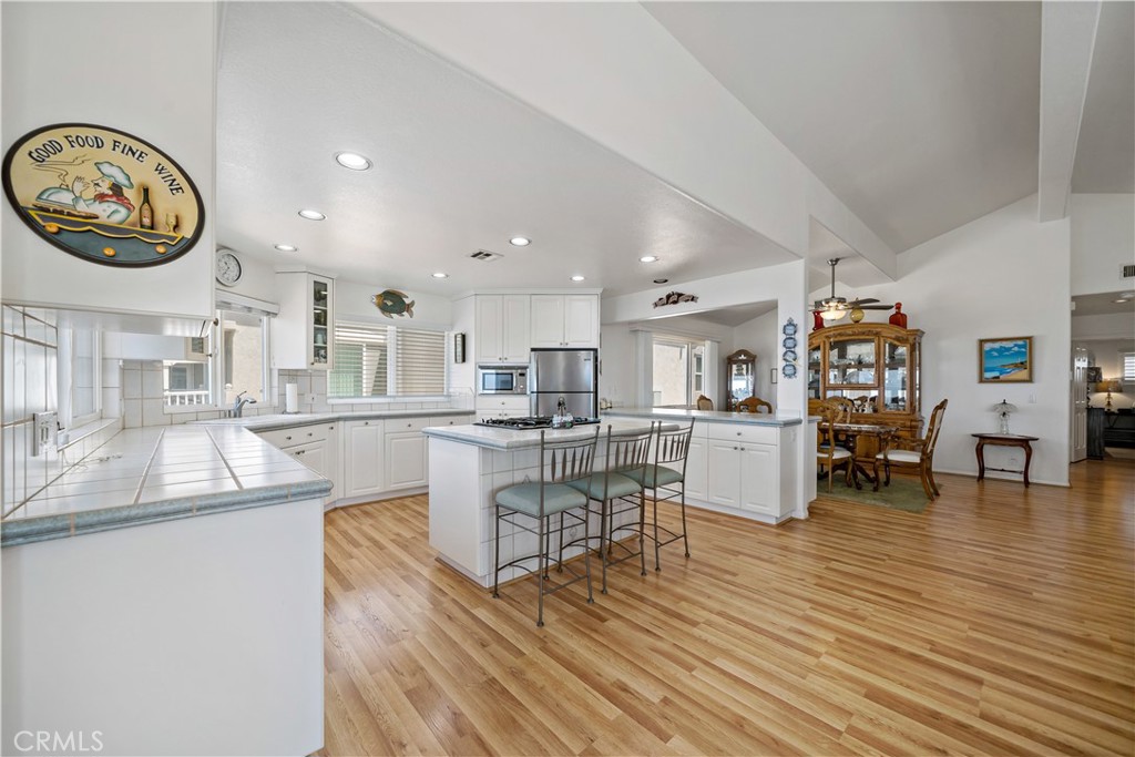 6536 Oceanview Drive, Unit T Carlsbad, CA 92011 - Photo 15 of 44 a living room with furniture and wooden floor