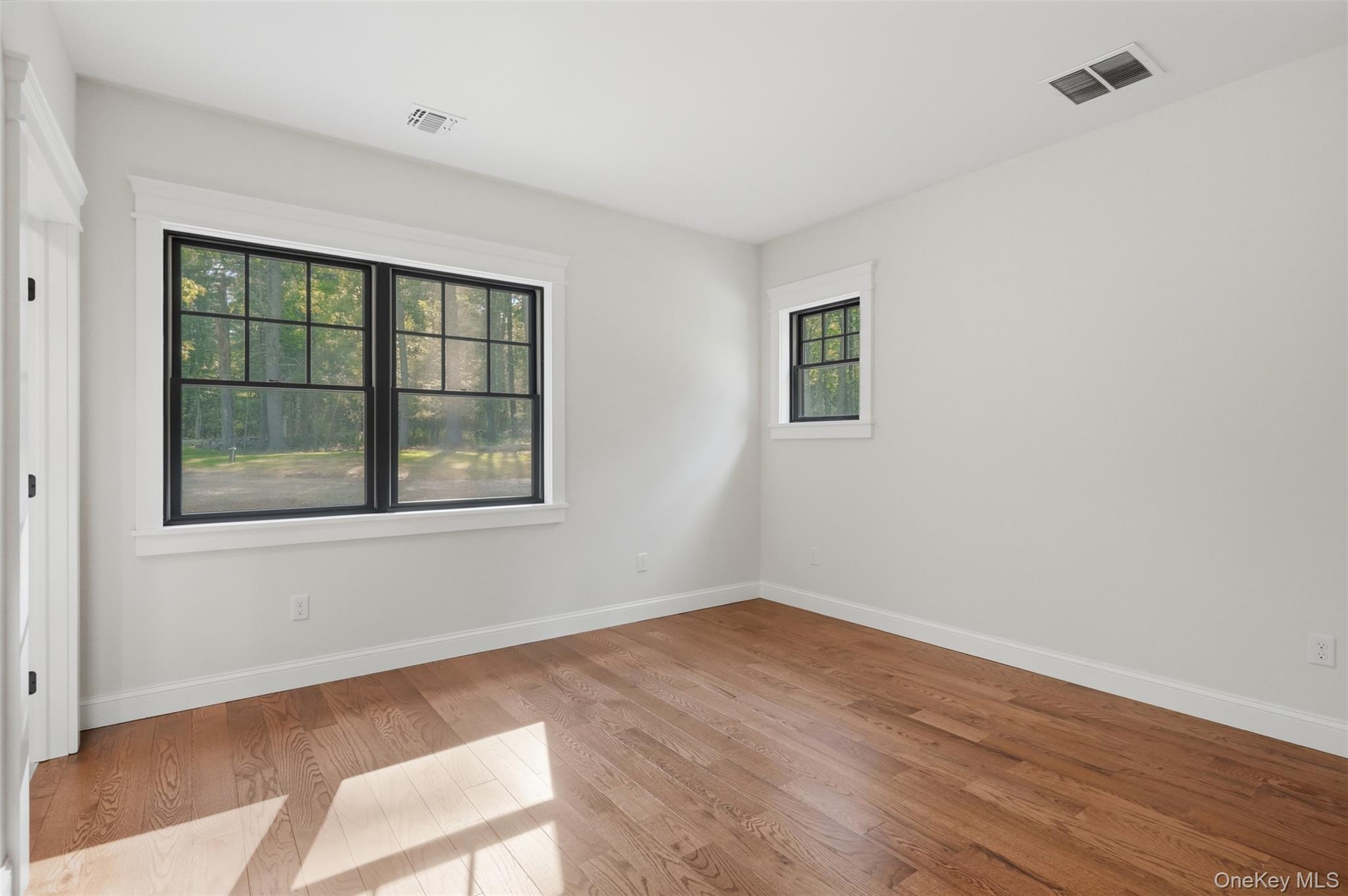 300 Van Tuyl Road Barryville, NY 12719 - Photo 37 of 50 an empty room with wooden floor and windows