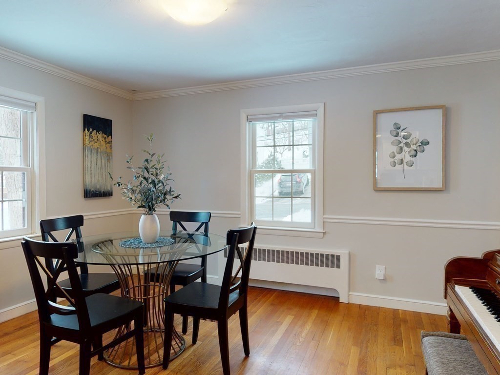 29 Baker Road Arlington, MA 02474 - Photo 13 of 36 a dining room with furniture and wooden floor