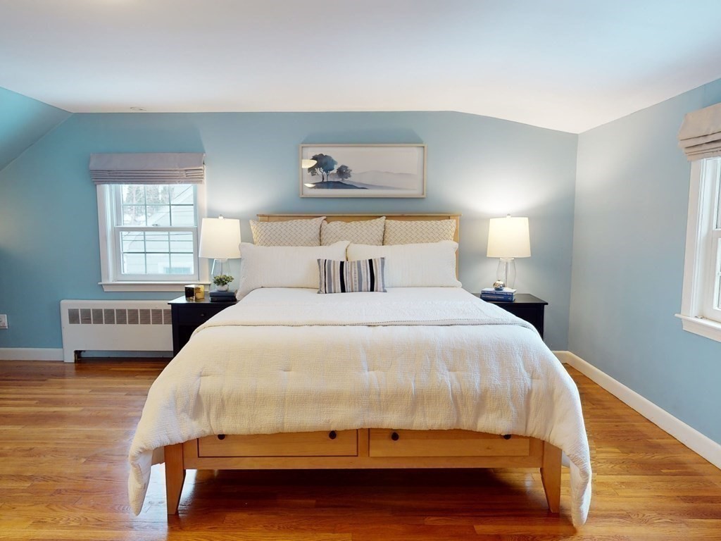 29 Baker Road Arlington, MA 02474 - Photo 19 of 36 a bedroom with a bed and a night stand