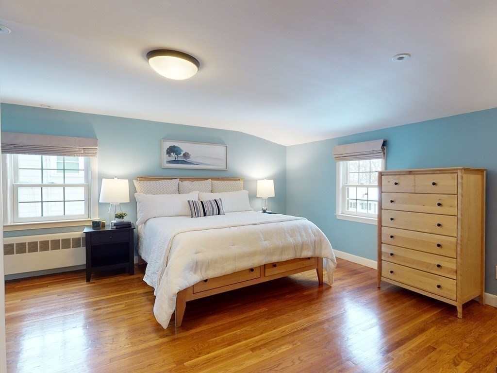 29 Baker Road Arlington, MA 02474 - Photo 20 of 36 a bedroom with a bed and a dresser
