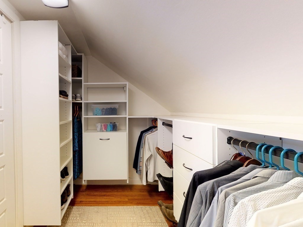29 Baker Road Arlington, MA 02474 - Photo 22 of 36 a view of walk in closet with clothes and shoes