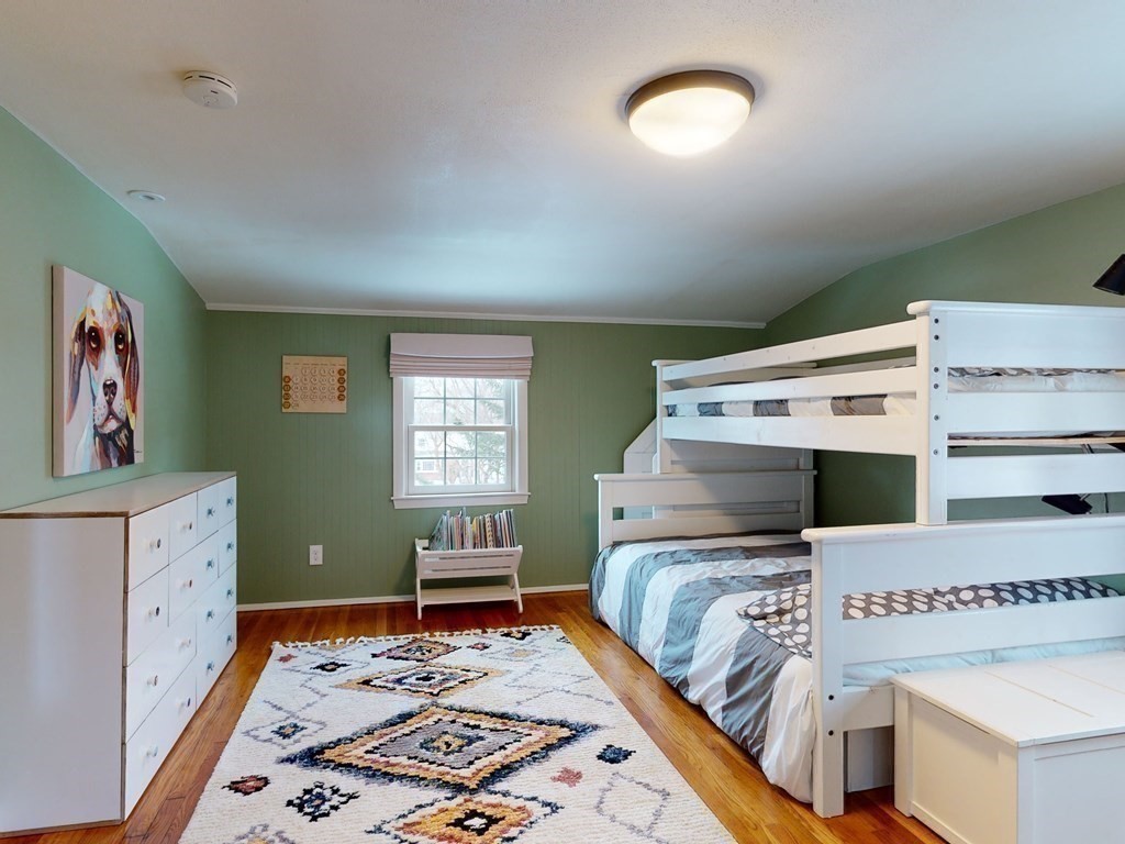 29 Baker Road Arlington, MA 02474 - Photo 24 of 36 a bedroom with a bed and a dresser in it