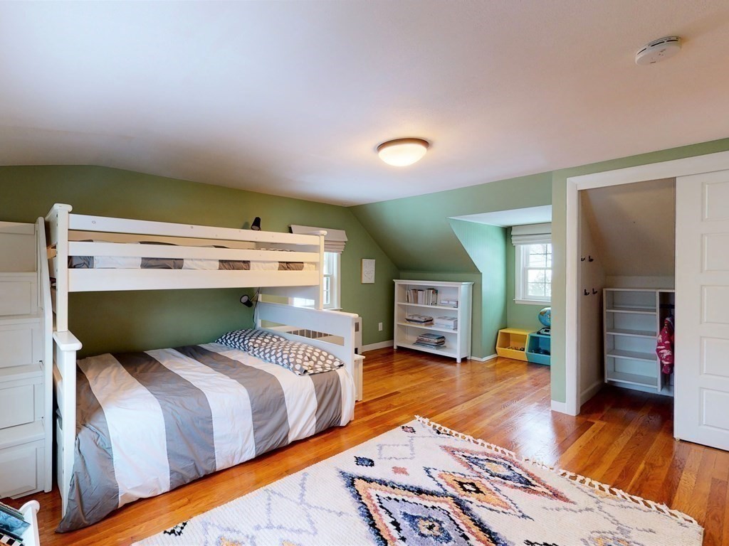 29 Baker Road Arlington, MA 02474 - Photo 25 of 36 a bedroom with a bed and a television