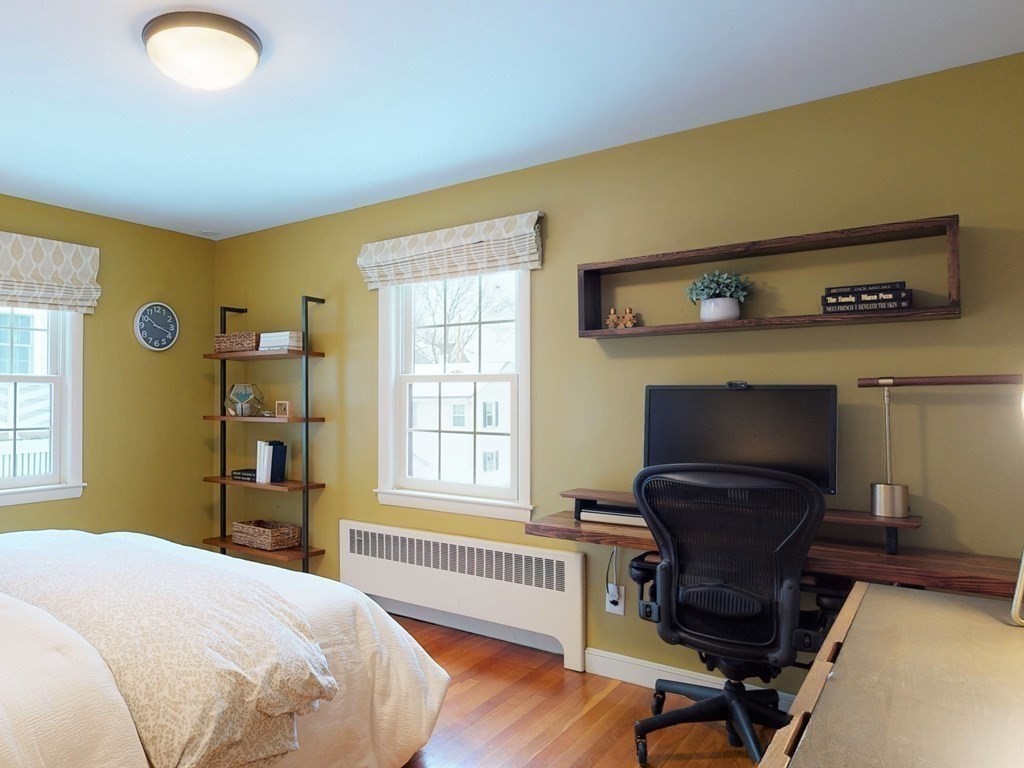 29 Baker Road Arlington, MA 02474 - Photo 26 of 36 a bedroom with a chair and a window
