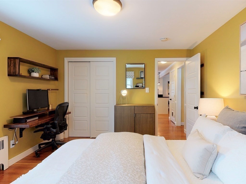 29 Baker Road Arlington, MA 02474 - Photo 28 of 36 a bedroom with a bed and a television