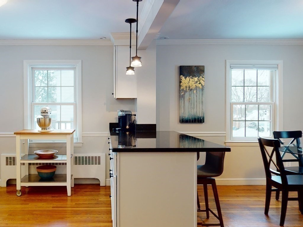 29 Baker Road Arlington, MA 02474 - Photo 10 of 36 a kitchen with a table and chairs in it