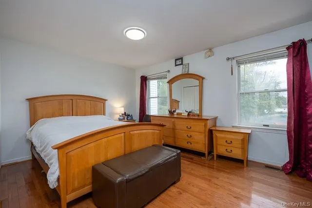 a bedroom with a bed and a dresser