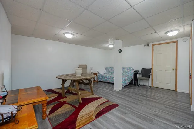 a workspace with furniture and wooden floor