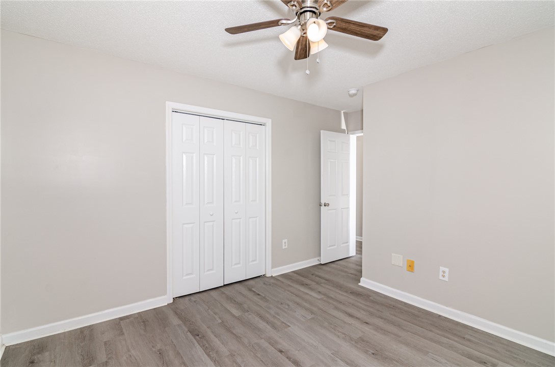 102 Hawk Ridge Drive Anderson, SC 29621 - Photo 18 of 38 This spacious bedroom features wood flooring, a ceiling fan, and ample closet space.