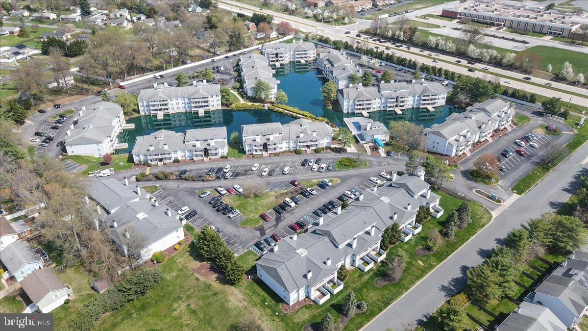 2702 Waters Edge Drive, Unit 2 Newark, DE 19702 - Photo 4 of 25 an aerial view of residential houses with outdoor space