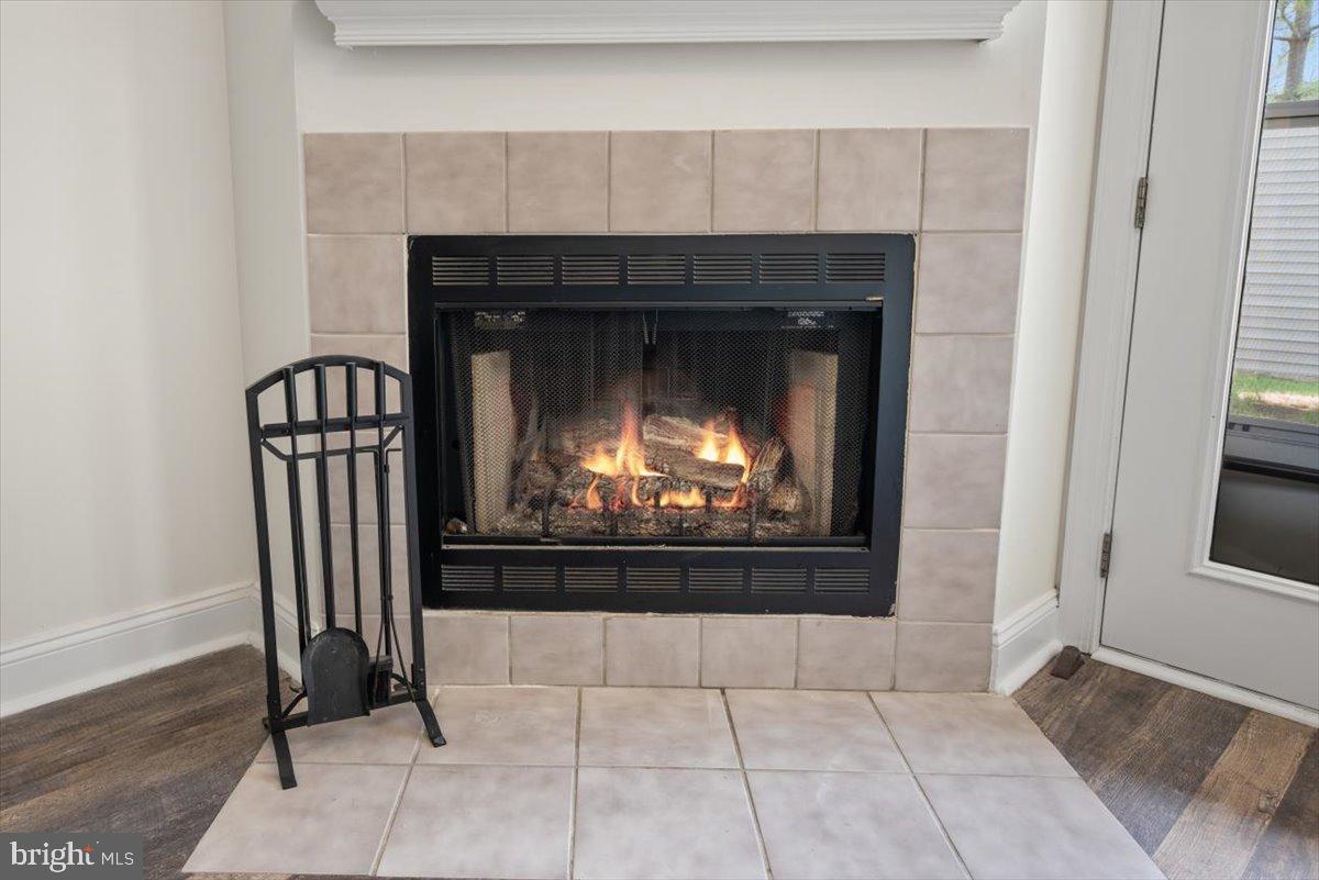 2702 Waters Edge Drive, Unit 2 Newark, DE 19702 - Photo 8 of 25 a living room with furniture and a fireplace