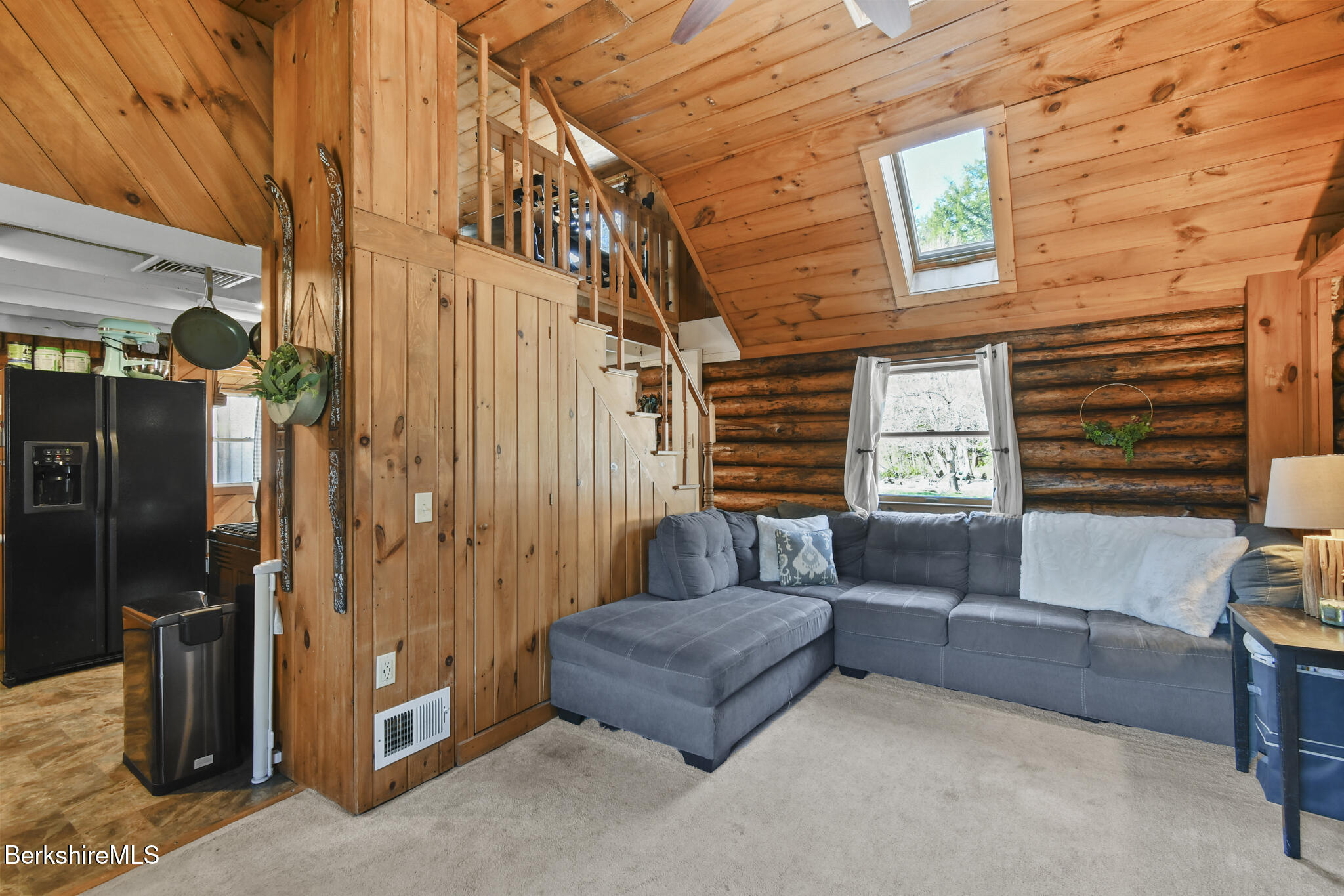 27 Shore Road Becket, MA 01223 - Photo 16 of 27 a view of a patio with couches and a fireplace