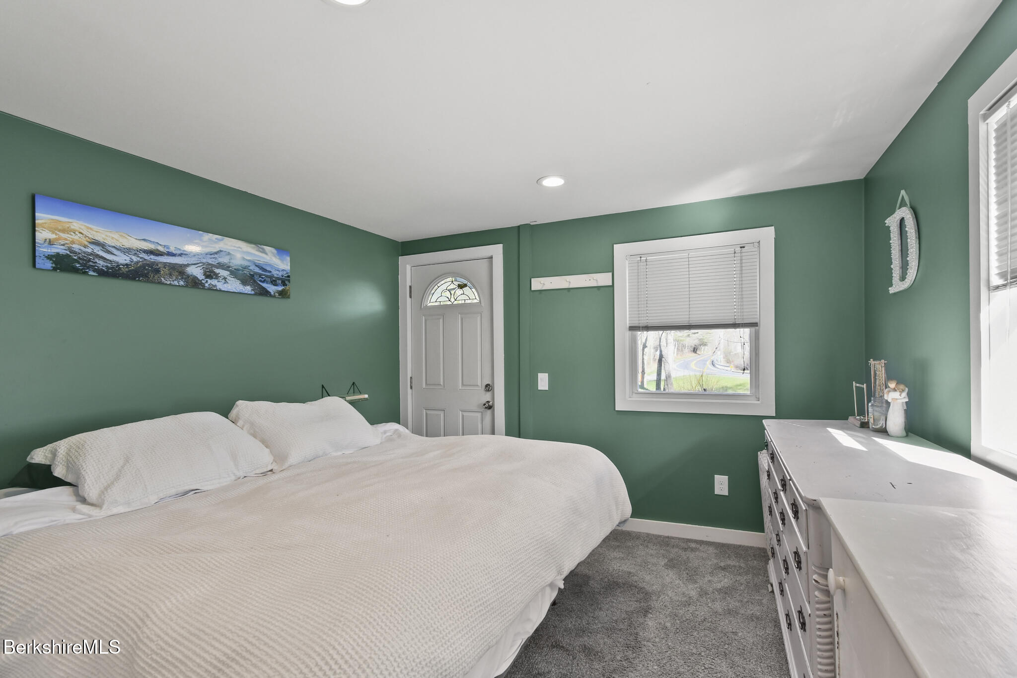 27 Shore Road Becket, MA 01223 - Photo 21 of 27 a bedroom with a bed and a painting on the wall