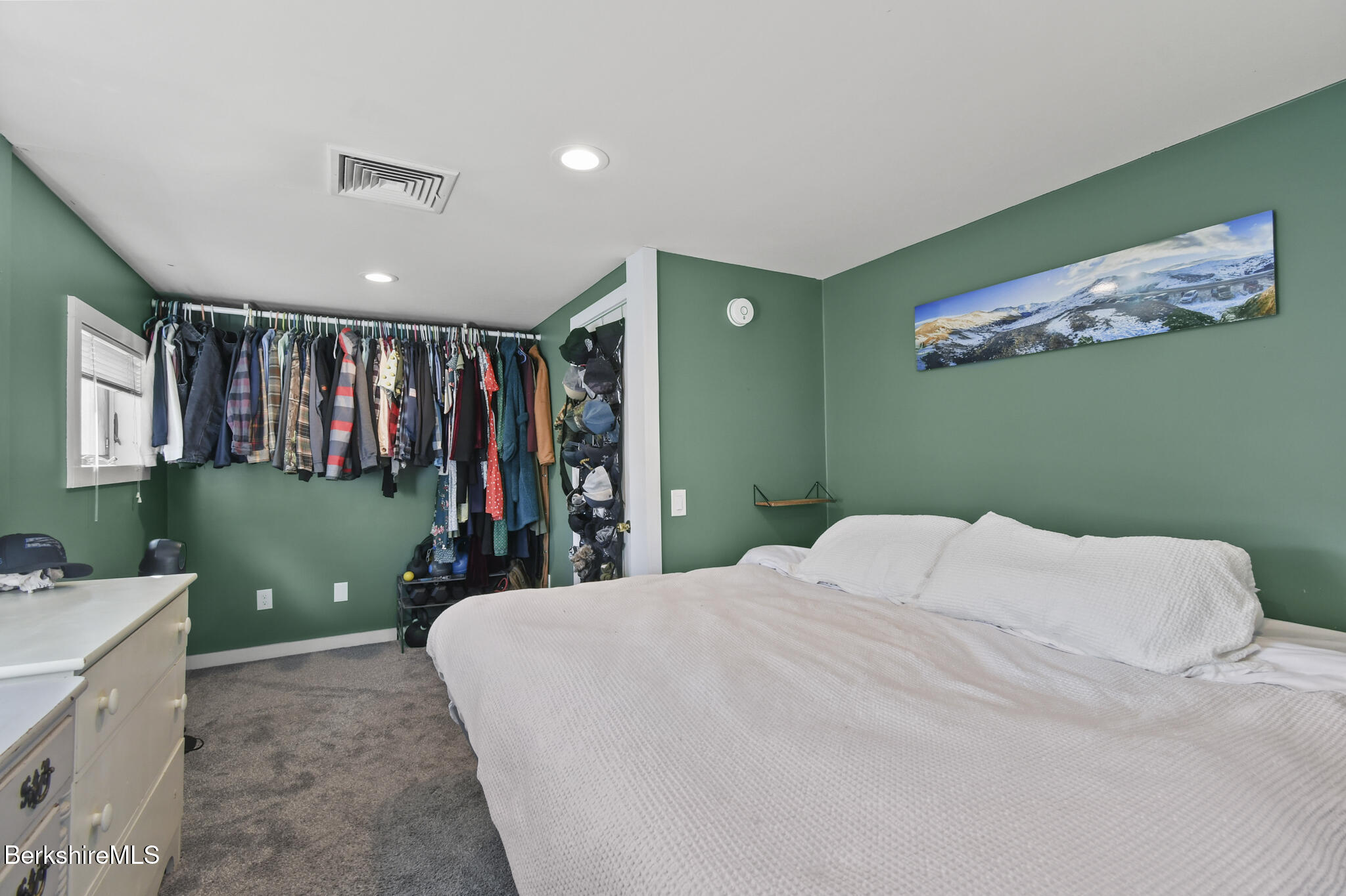 27 Shore Road Becket, MA 01223 - Photo 22 of 27 a bedroom with a bed and a large mirror