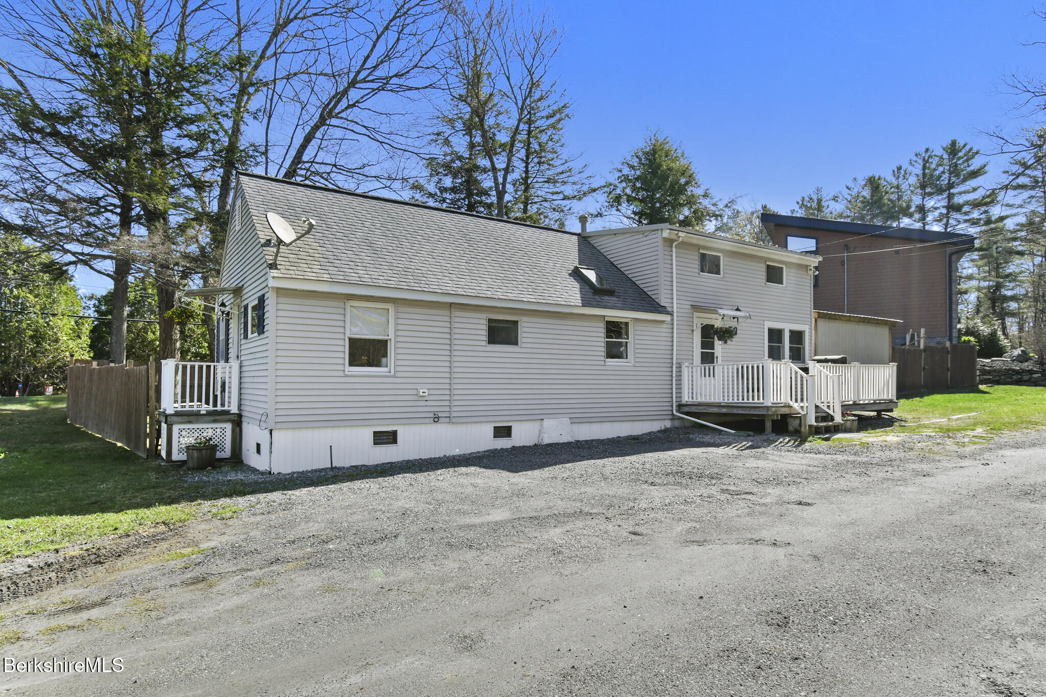 27 Shore Road Becket, MA 01223 - Photo 4 of 27 a view of a house with a yard and garage