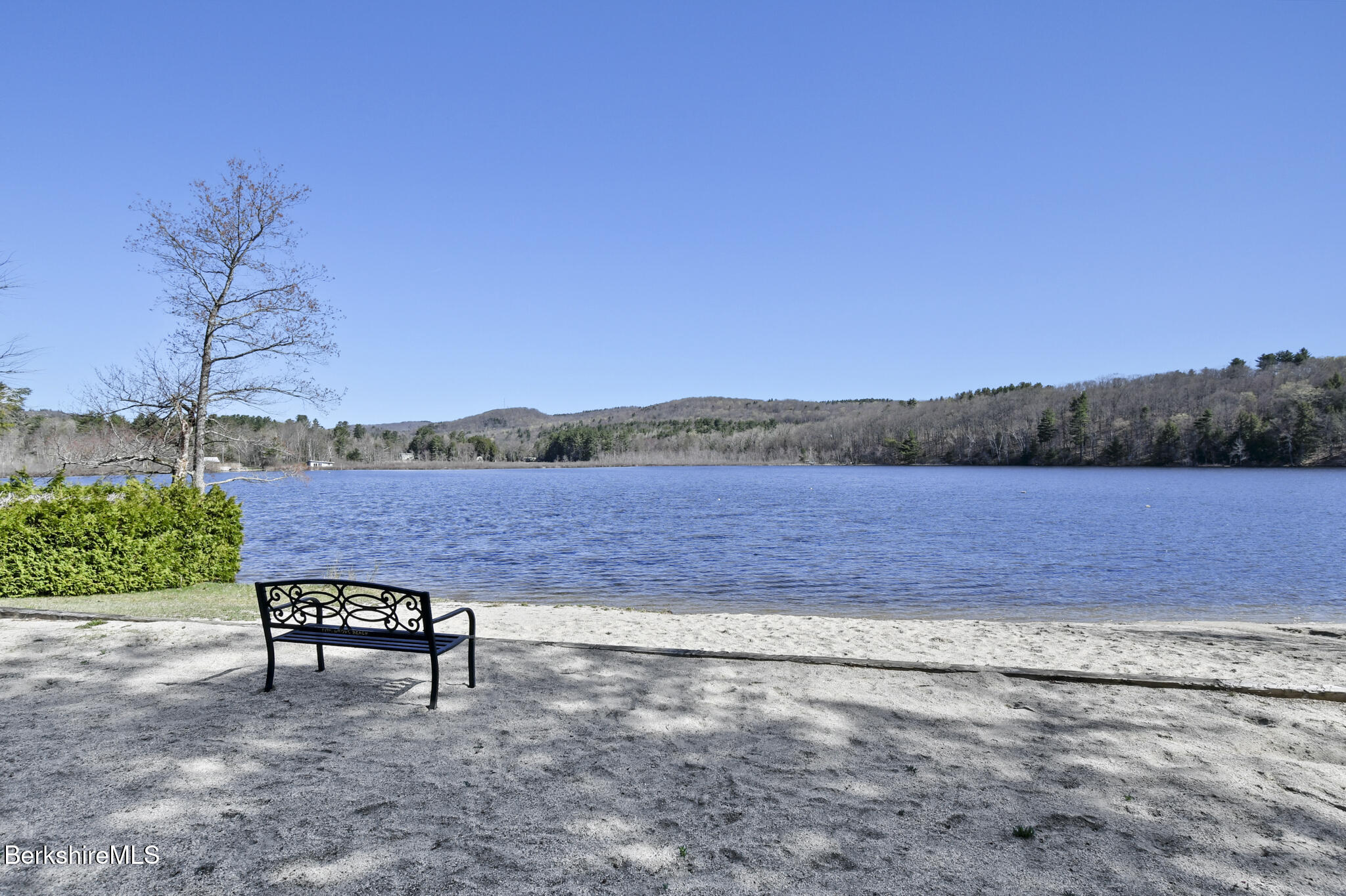 27 Shore Road Becket, MA 01223 - Photo 7 of 27 a view of a bench in front of a lake