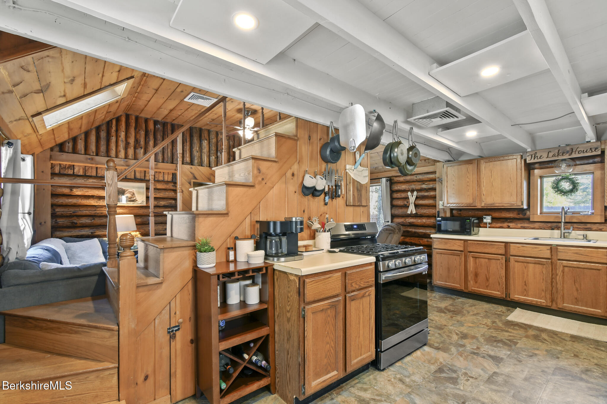 27 Shore Road Becket, MA 01223 - Photo 9 of 27 a kitchen that has a lot of cabinets in it