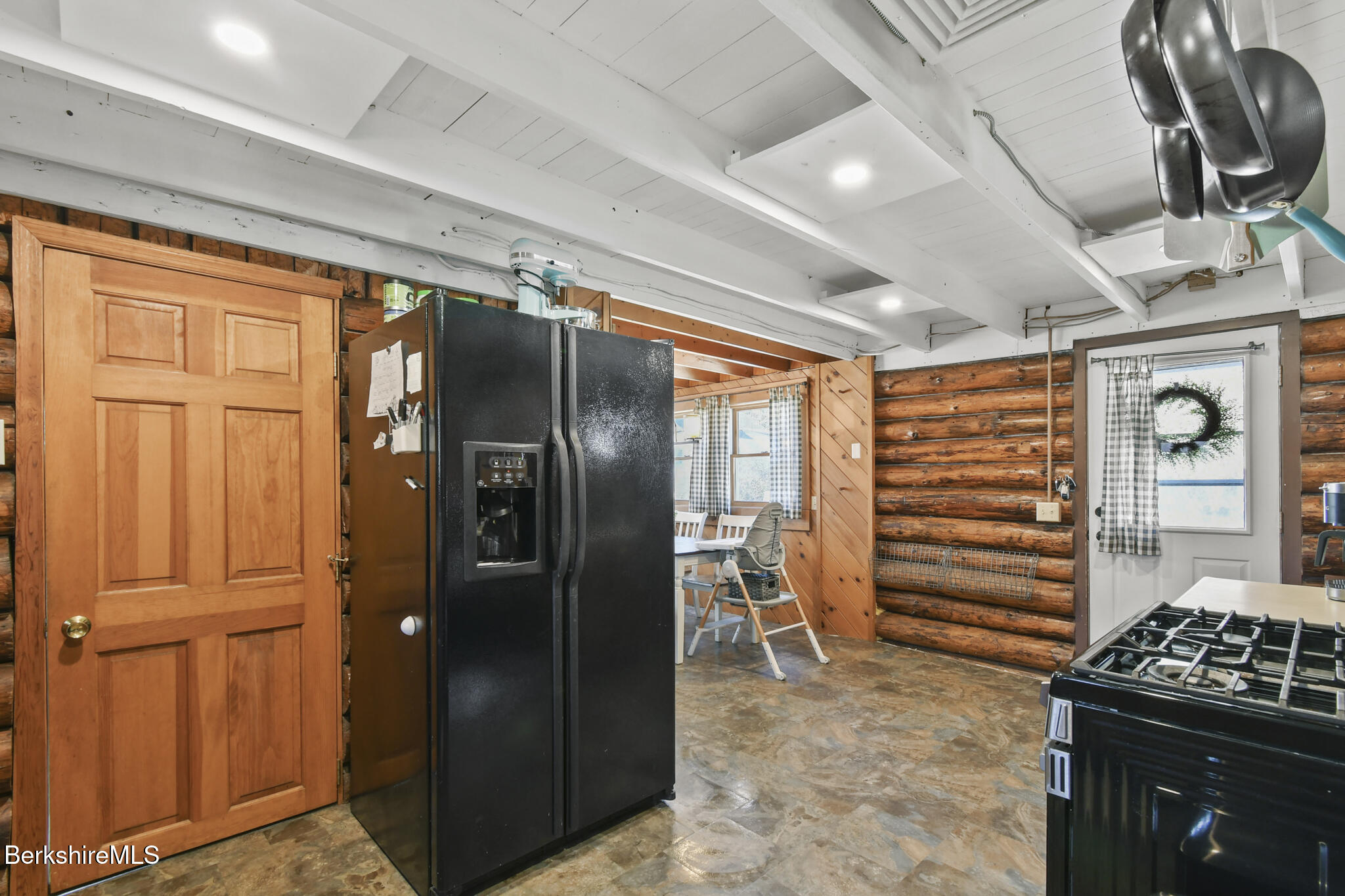 27 Shore Road Becket, MA 01223 - Photo 10 of 27 a kitchen with stainless steel appliances granite countertop a refrigerator and a stove
