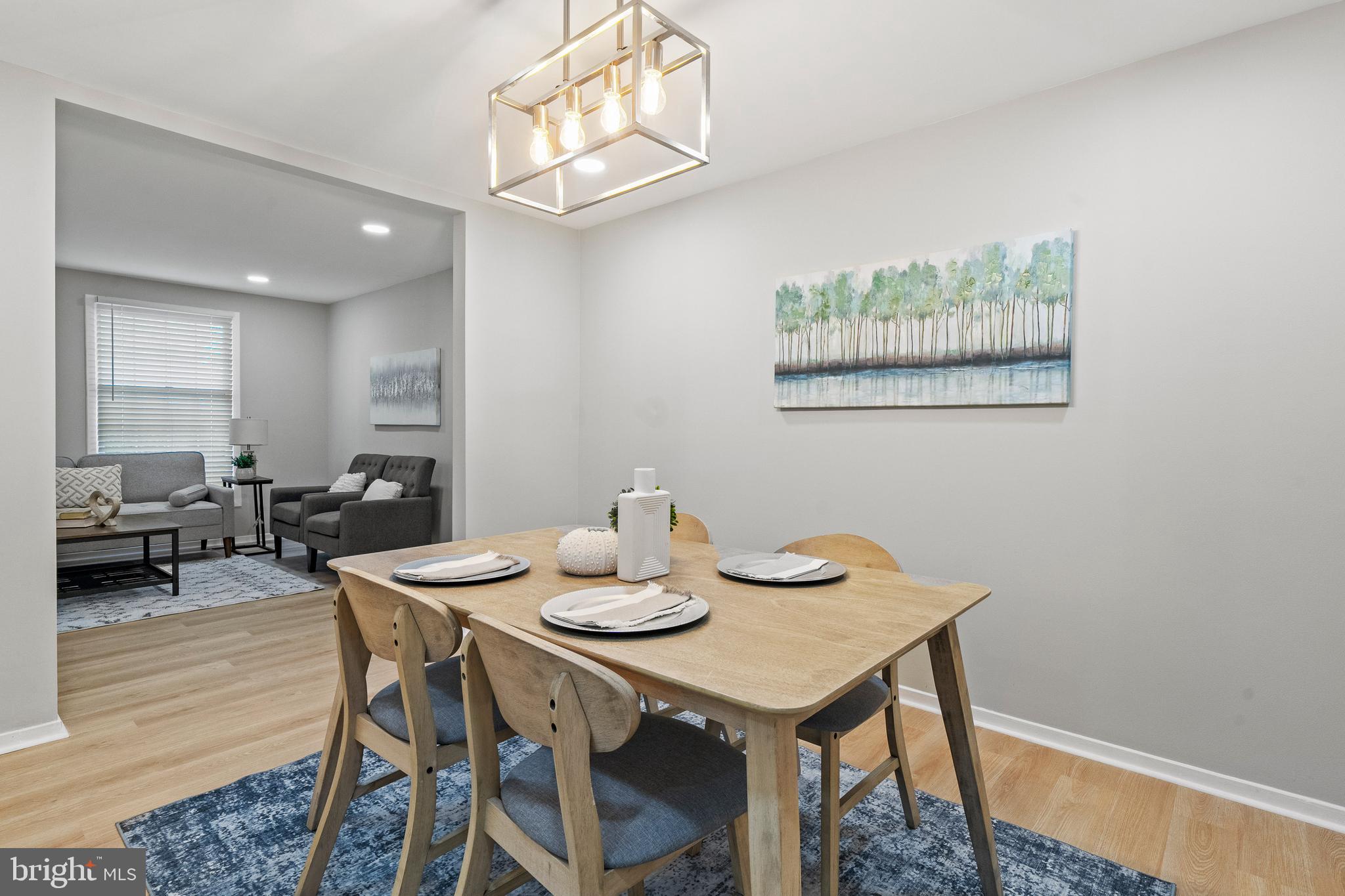 6122 Mantle Road Burke, VA 22015 - Photo 11 of 51 a view of a dining room with furniture and wooden floor