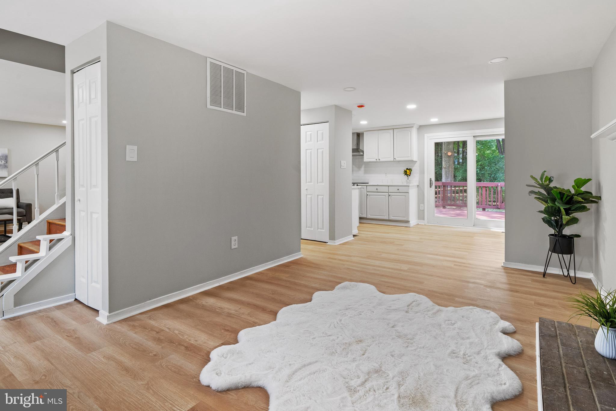 6122 Mantle Road Burke, VA 22015 - Photo 14 of 51 a view of a livingroom with furniture and a potted plant