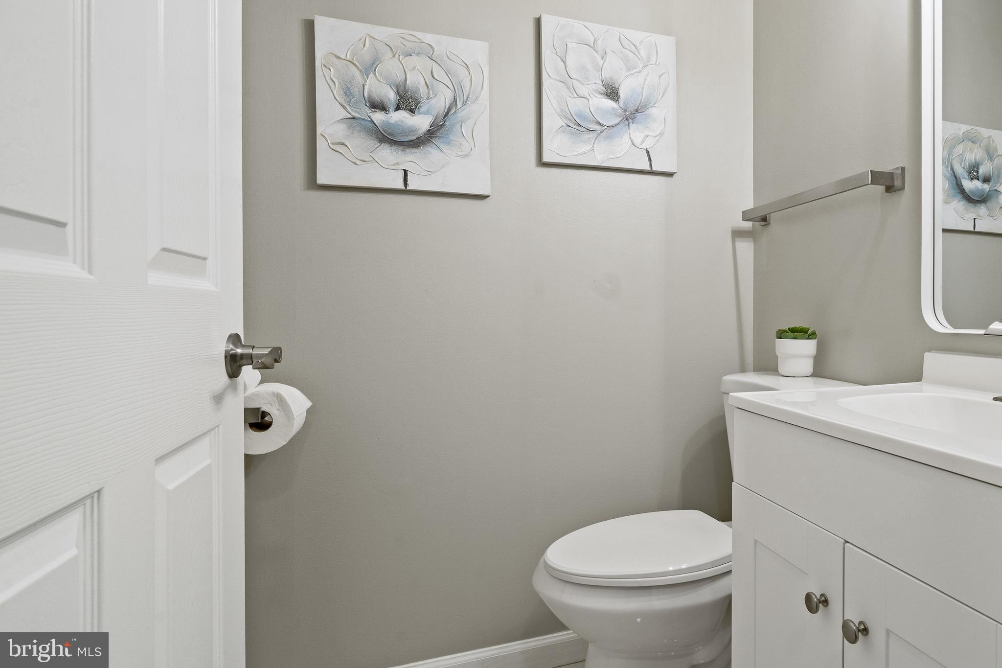 6122 Mantle Road Burke, VA 22015 - Photo 16 of 51 a bathroom with a toilet and a sink