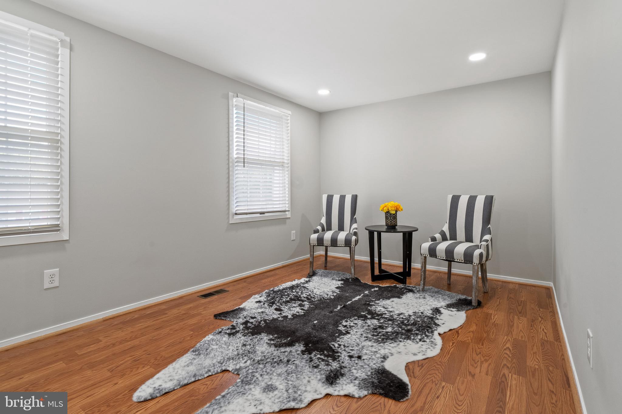 6122 Mantle Road Burke, VA 22015 - Photo 17 of 51 a workspace room with furniture and wooden floor