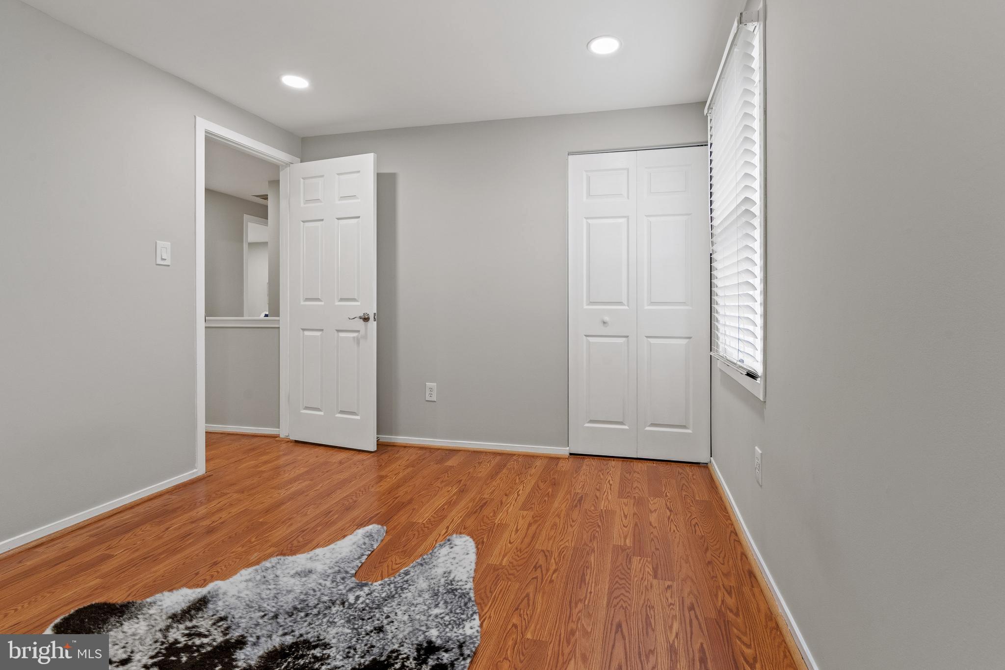 6122 Mantle Road Burke, VA 22015 - Photo 18 of 51 a view of a room with wooden floor and a bathroom
